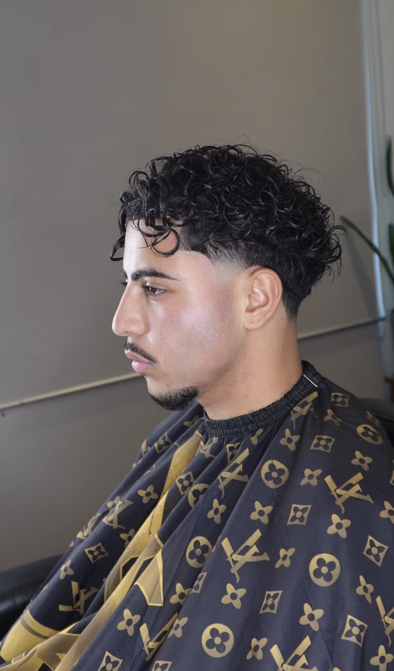 Loui cape haircut with a clean taper fade