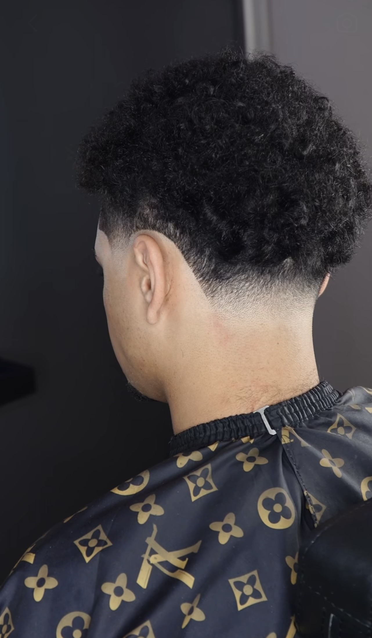 Finished curly taper fade from the back