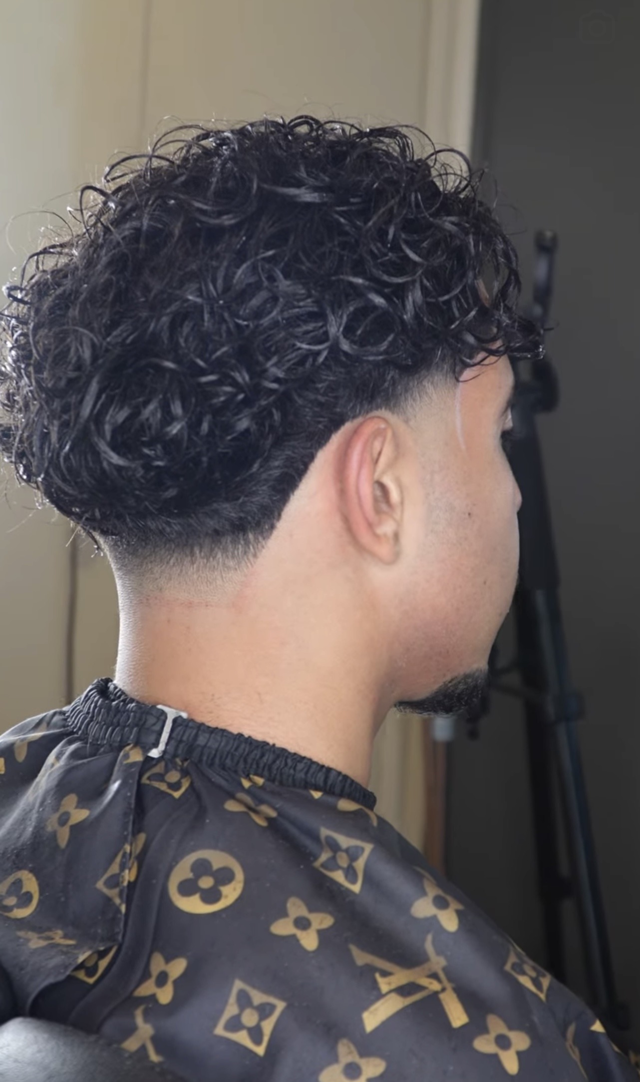 Back view of a textured taper fade